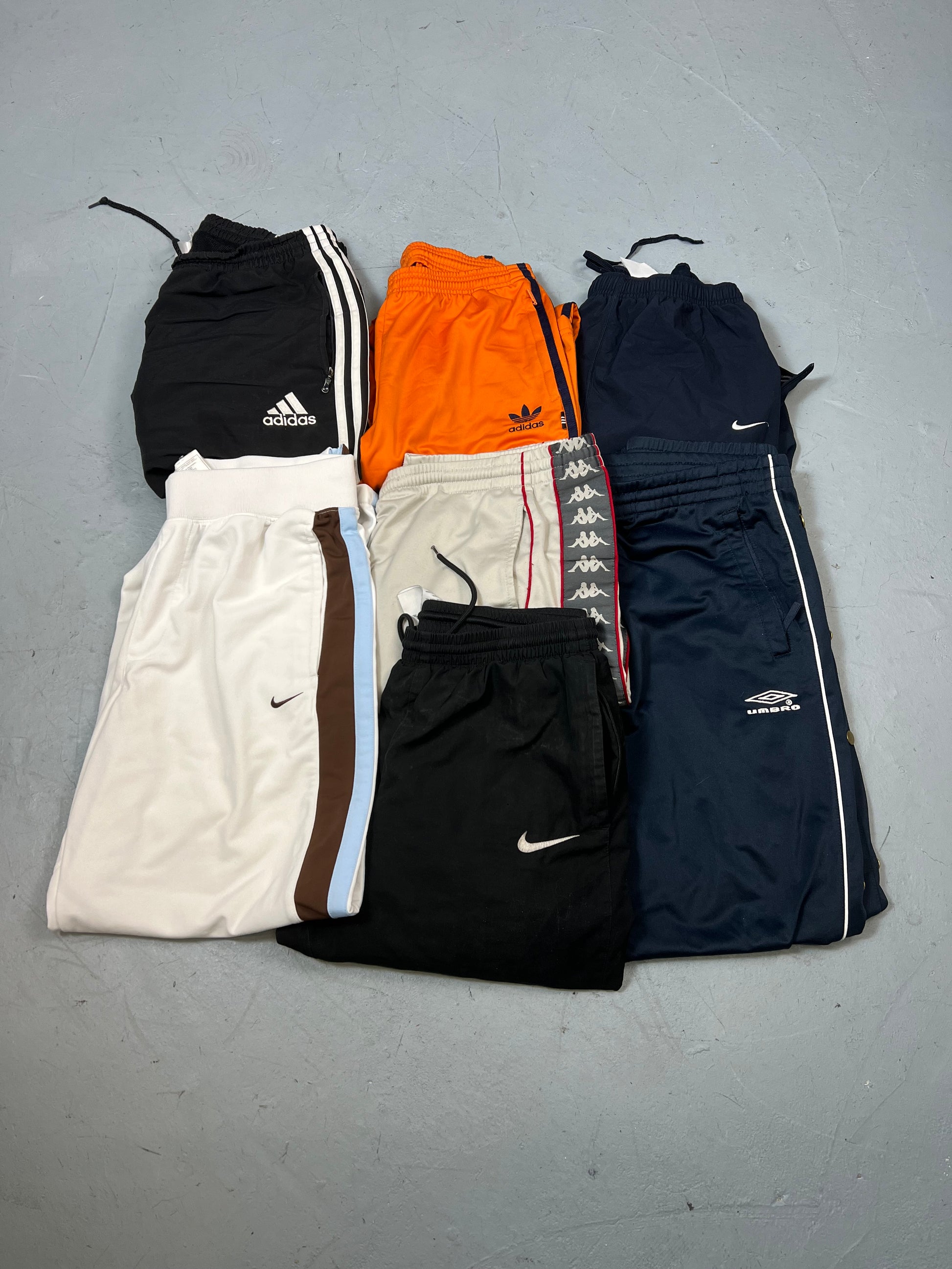 COMPRA LOS MEJORES TRACK PANTS DE MARCA PREMIUM USADOS AL MEJOR PRECIO DEL MERCADO TEXTIL